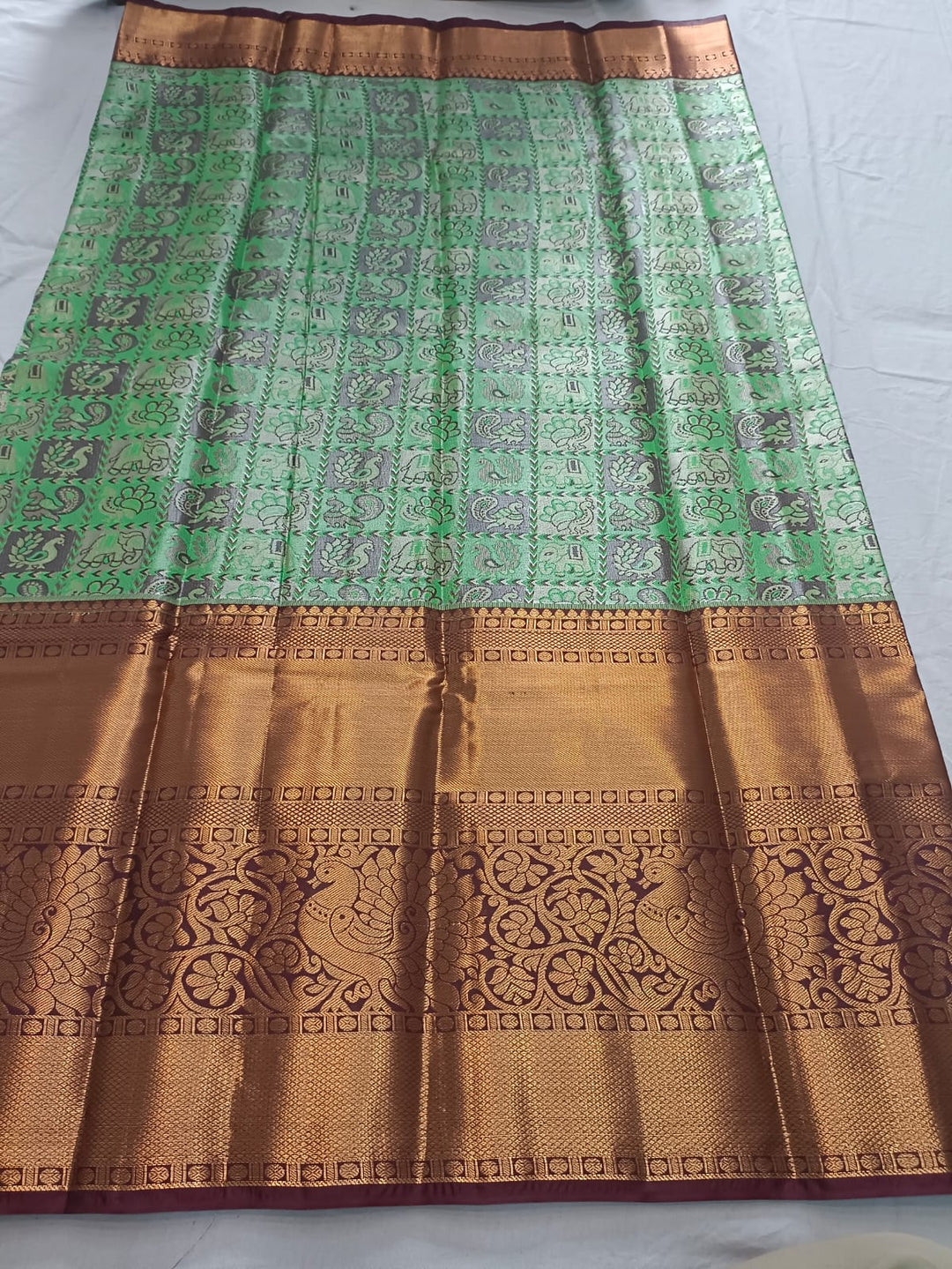 Tathastu Mint Green &amp; Copper Zari Printed Saree